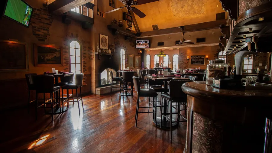 Bar and lounge with hardwood floors